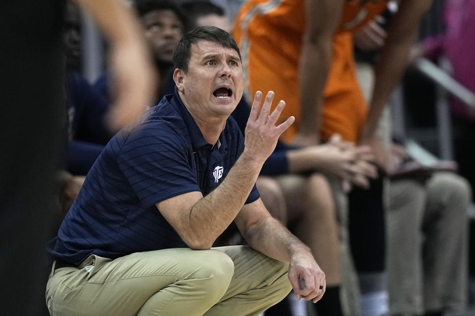 UTEP coach Joe Golding talks to the team during the first half of an NCAA college basketball game against Kansas on Tuesday, Dec. 7, 2021, in Kansas City, Mo. (AP Photo/Charlie Riedel)