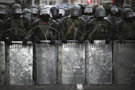 Belarusian police block a street during an opposition rally to protest the official presidential election results in Minsk, Belarus, Sunday, Oct. 25, 2020. The demonstrations were triggered by official results giving President Alexander Lukashenko 80% of the vote in the Aug. 9 election that the opposition insists was rigged. Lukashenko, who has ruled Belarus with an iron fist since 1994, has accused the United States and its allies of fomenting unrest in the ex-Soviet country. (AP Photo)