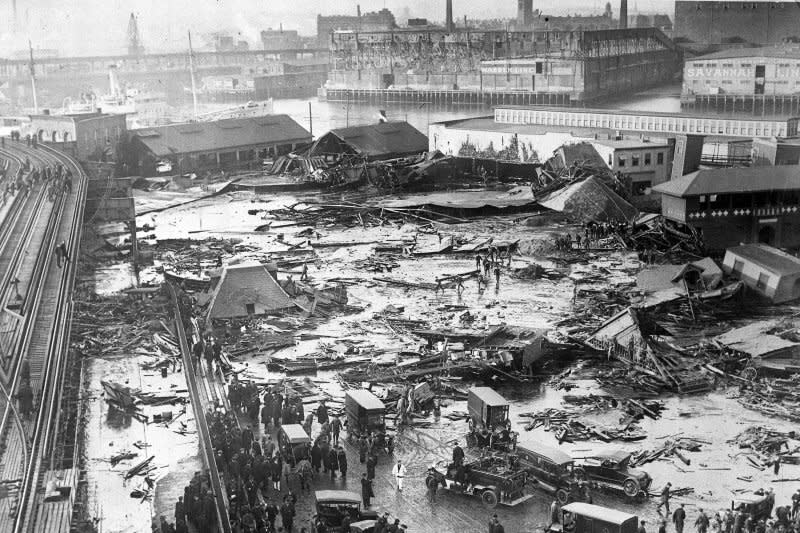 On Jan. 15 1919, 21 people were killed and scores injured when a vat holding 2.3 million gallons of molasses exploded and sent torrents of the syrup into the streets of Boston. The event is known as the Boston Molasses Disaster. File Photo courtesy of the Globe Newspaper Co.