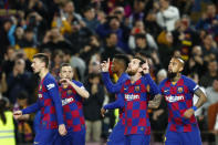 Barcelona's Lionel Messi, second right, celebrates after scoring his side's opening goal from the penalty spot during a Spanish La Liga soccer match between Barcelona and Real Sociedad at the Camp Nou stadium in Barcelona, Spain, Saturday, March 7, 2020. (AP Photo/Joan Monfort)