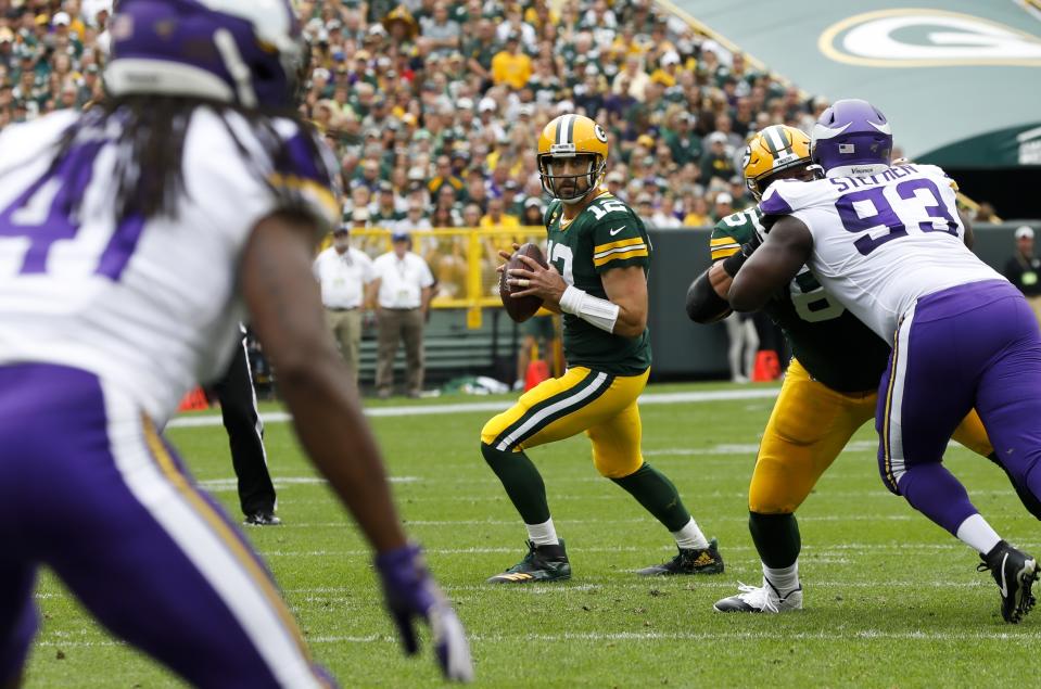 FILE - Green Bay Packers' Aaron Rodgers throws during the first half of an NFL football game against the Minnesota Vikings, Sunday, Sept. 15, 2019, in Green Bay, Wis. Aaron Rodgers will begin his 16th season with Green Bay looking to continue his remarkable run of success against NFC North opponents as the Packers visit Minnesota. The Packers own a 47-18-1 record in games Rodgers has played against NFC North foes, including a 6-0 mark last season. (AP Photo/Mike Roemer, File)