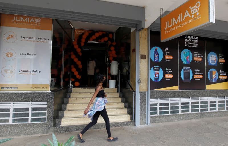 A woman walks past a Jumia Technologies, pickup station in downtown Nairobi