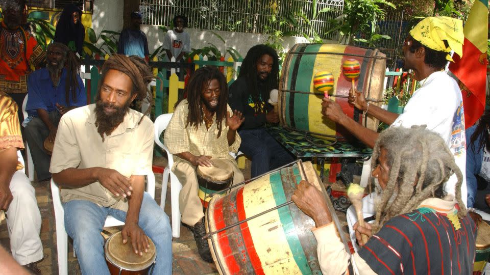 Rastafarians beat on African drums to mark the 59th birthday of late reggae legend Bob Marley on February 6, 2004, in Kingston, Jamaica. - Collin Reid/AP