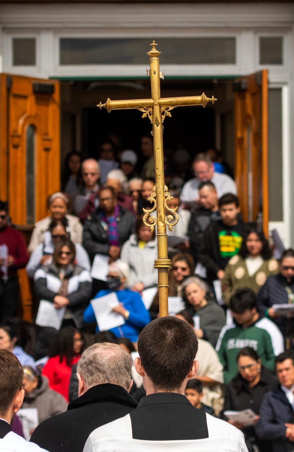 A Stations of the Cross procession leaves St. John’s Church to make stops through downtown on Good Friday.