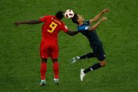 <p>France’s defender Raphael Varane (R) reacts as he heads the ball next to Belgium’s forward Romelu Lukaku (L) during the Russia 2018 World Cup semi-final football match between France and Belgium at the Saint Petersburg Stadium in Saint Petersburg on July 10, 2018. (Photo by Adrian DENNIS / AFP) </p>