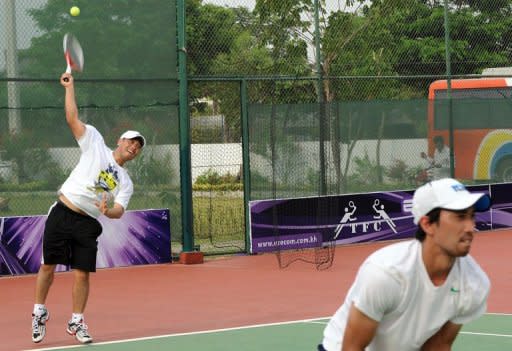 A Cambodian tennis player serves the ball during a training session in Phnom Penh. When the country's number one player Bun Kenny steps onto the court in Qatar for the Davis Cup being played April 16 to 22, it will mark the crowning moment of years of effort to revive a sport that was all but wiped out by the brutal Khmer Rouge regime in the late 1970s for being 'too upper-class.'