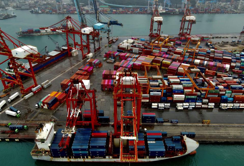 A cargo ship being loaded with containers at the harbour in Keelung, Taiwan.