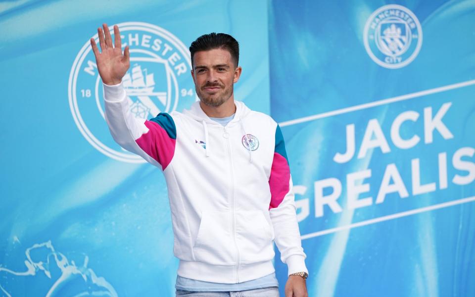 Manchester City's new singing Jack Grealish greet fans outside after the press conference - PA