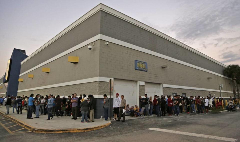 Best Buy shoppers line up around the building waiting for the store to open to start their Holiday shopping on Thanksgiving, November 29, 2013.