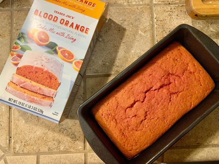 box of trader joe&#39;s blood orange cake mix beside cooked loaf