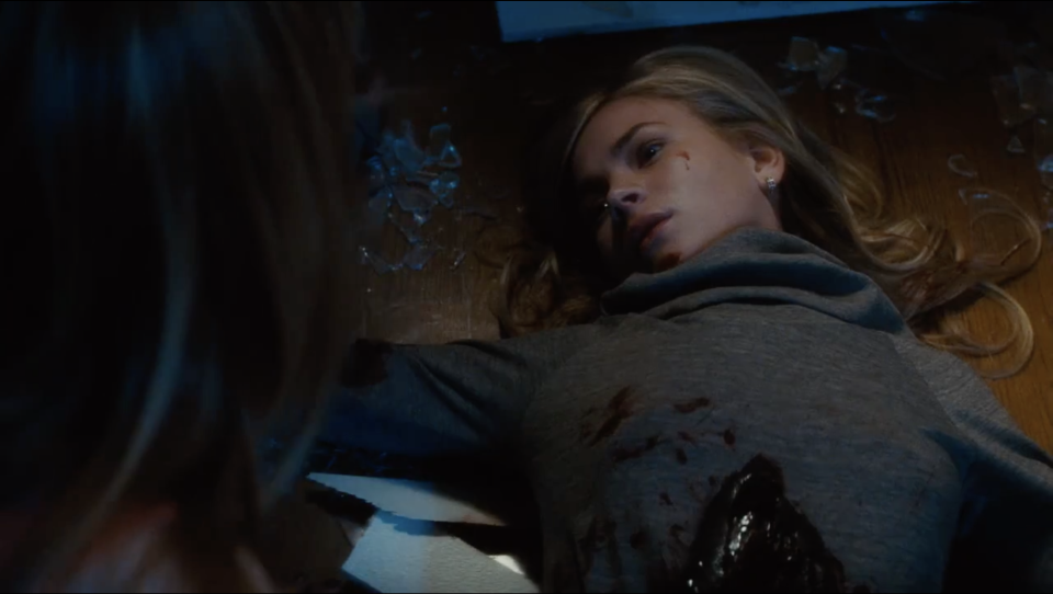 Britt Robertson dead in a pile of glass