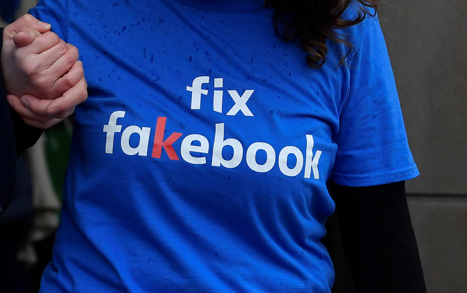 A campaigner from a political pressure group protests as founder and CEO of Facebook Mark Zuckerberg failed to attend a meeting on fake news held by Parliament's Digital, Culture Media and Sport committee in London November 27, 2018.  REUTERS/Toby Melville