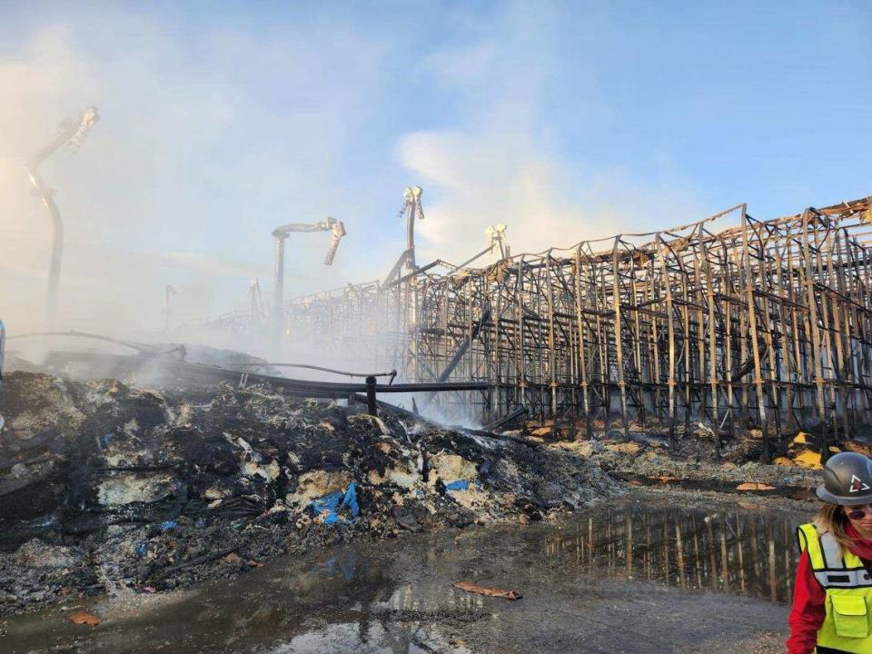 Fire flared up at the Kennewick Lineage cold storage warehouse in strong winds during efforts to put out the fire.