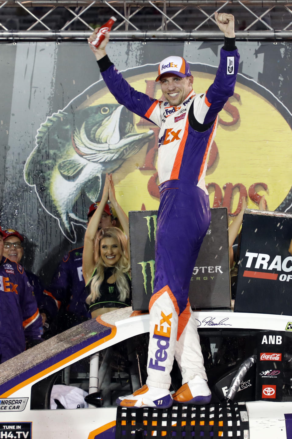 Denny Hamlin celebrates after winning the NASCAR Cup Series auto race Saturday, Aug. 17, 2019, in Bristol, Tenn. (AP Photo/Wade Payne)