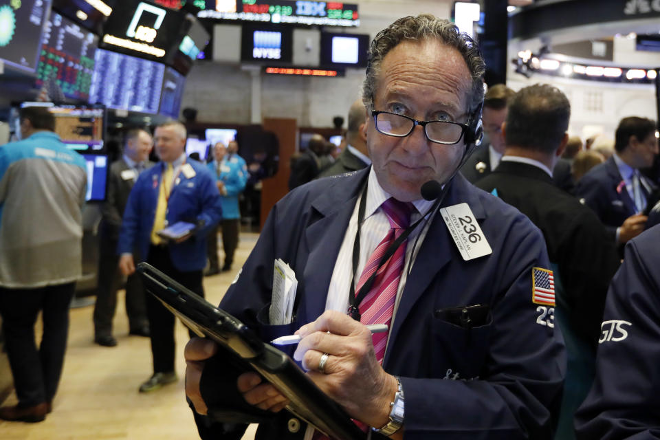 Trader Steven Kaplan works on the floor of the New York Stock Exchange, Friday, Oct. 26, 2018. Stocks are opening broadly lower on Wall Street, a day after a massive surge, as a number of big companies reported disappointing results. (AP Photo/Richard Drew)