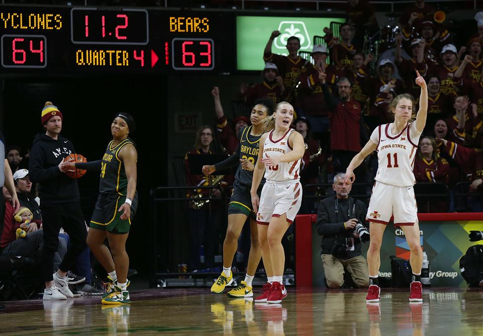 Iowa State's Hannah Belanger, left, and Emily Ryan (11) celebrate during the Cyclones' victory over Baylor on Jan. 13 in Ames.