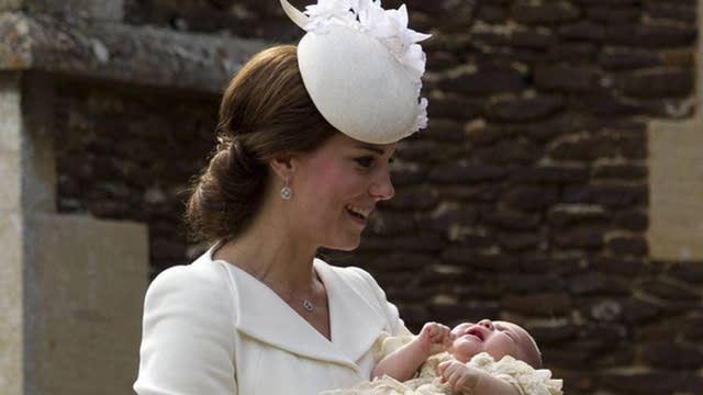 It's Princess Charlotte's big day! The two-month old was christened on Sunday, July 5, at the Church of St. Mary Magdalene in Norfolk, England. Prince William and Kate Middleton watched over their little girl at the ceremony as her two-year-old brother Prince George nearly stole the show - again! Much of the rest of the royal family were there including William's father Prince Charles and his wife Camilla, and his grandparents, the Queen and Duke of Edinburgh, as well as Kate's parents, Carole and Michael Middleton <strong>PHOTOS: Princess Charlotte's First Pics!</strong> Charlotte's uncle Prince Harry was notably absent but only because he is currently in Nambia working with the Nature Conservancy. Both the location and ceremony were steeped in tradition. The church was the same church that Charlotte's late grandmother Princess Diana was baptized in back in 1961, while the buggy Charlotte was pushed in was used by Queen Elizabeth for her children, Princes Edward and Andrew. Charlotte even wore the same historic gown George wore at his christening. <strong>WATCH: Prince William and Kate Middleton Welcome Baby No. 2</strong> Prince George's look was also a throwback -- he wore a pair of short red trousers and a white top, an outfit very similar to the one his father wore as a child on his first visit to meet newborn Harry at the hospital back in 1984. <strong>PHOTOS: A Royal Family Photo Album</strong> Even more adorable? Little George peeking at his baby sister in her carriage! Kate, meanwhile, took a fresh twist on tradition, wearing a cream-colored Alexander McQueen ensemble complete with a fetching feathered hat. After weeks of whispering, Kensington Palace confirmed the names of Charlotte's godparents. Prince Harry is not among the five names -- but, don't worry, its not a snub! He is already a godparent to Prince George, who has seven godparents. <strong>NEWS: Happy Birthday AND Father's Day, Prince William!</strong> Who did make the cut for Charlotte? Sophie Carter, James Meade, Adam Middleton, Lady Laura Fellowes, and Thomas van Straubenzee. Royal super fans know that Carter, Meade and van Straubenzee are close pals of the Duke and Duchess, while Middleton is Kate's cousin. Choosing Lady Fellowes was a touching tribute to William's late mother as she is Princess Diana's niece. What a gorgeous day for the royal family!