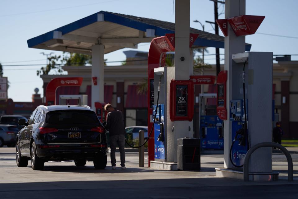 A man pumps gas into his suv at an Exxon gas station on September 21, 2022 in Los Angeles, California.