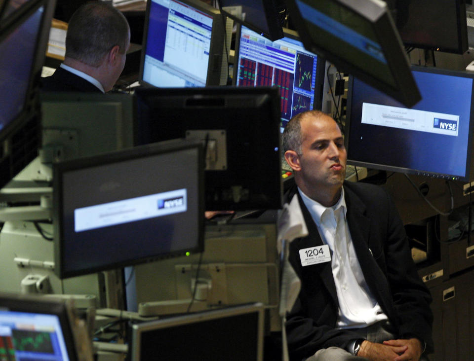 Traders work on the floor of the New York Stock Exchange, October 2, 2008. U.S. stocks slid on Thursday as tight credit markets and bleak economic data forced investors to focus on the rocky road still ahead for the U.S. economy even if Congress passes a $700 billion rescue package.     REUTERS/Brendan McDermid (UNITED STATES)