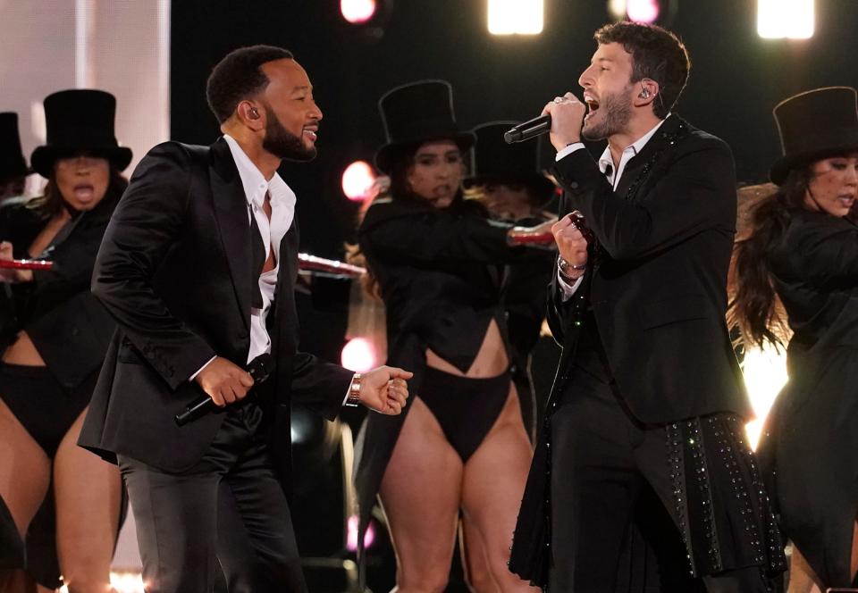 John Legend, left, and Sebastián Yatra perform "Tacones Rojos."