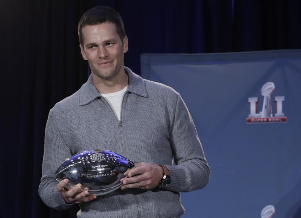 Tom Brady and the Super Bowl LI MVP trophy. (AP)