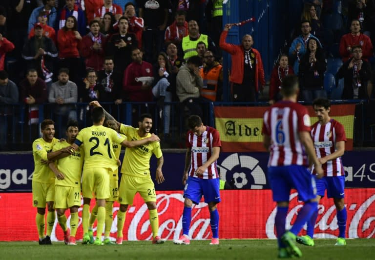 Villarreal's players celebrate after midfielder Roberto Soriano scored during the Spanish league football match against Atletico Madrid April 25, 2017