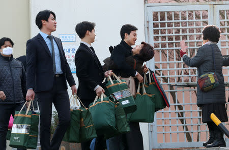 South Korean conscientious objectors celebrate after being released from Daegu detention center in Daegu, South Korea, November 30, 2018. Yonhap via REUTERS