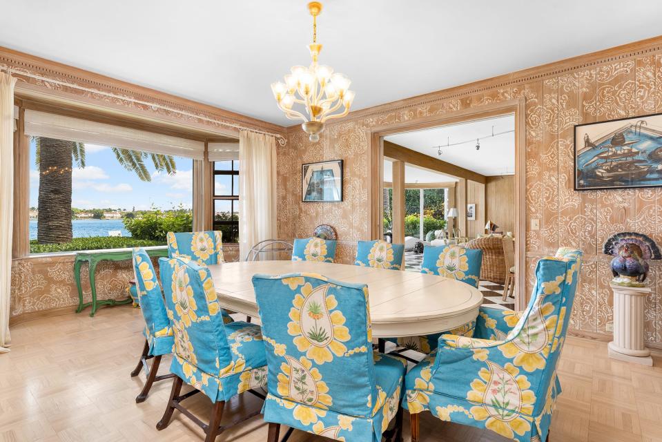 The dining room has its original paneling, which has been stenciled.