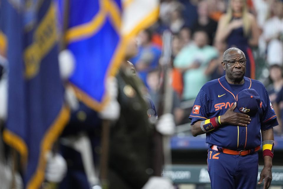 Houston Astros manager Dusty Baker Jr. removes his cap during a remembrance on Memorial Day before a baseball game against the Minnesota Twins Monday, May 29, 2023, in Houston. (AP Photo/David J. Phillip)