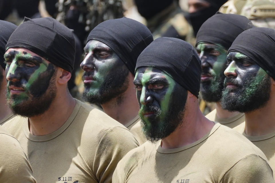 Fighters from the Lebanese militant group Hezbollah carry out a training exercise in Aaramta village in the Jezzine District, southern Lebanon, Sunday, May 21, 2023. The show of force came ahead of "Liberation Day," the annual celebration of the withdrawal of Israeli forces from south Lebanon on May 25, 2000, and in the wake of a recent escalation of the Israel-Palestine conflict in the Gaza Strip. (AP Photo/Hassan Ammar)