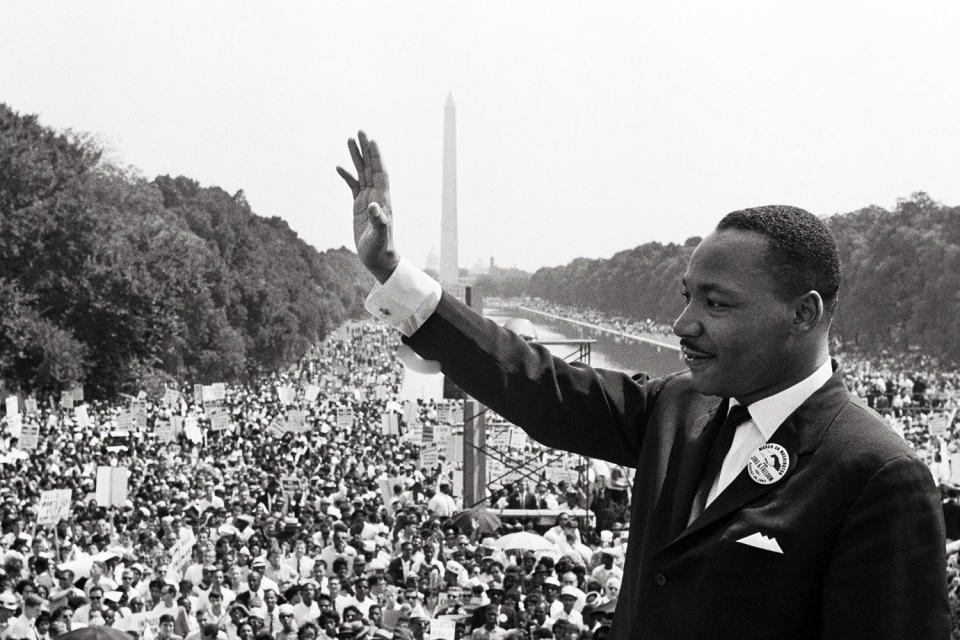 Martin Luther King Jr. waves to supporters on the Mall. (AFP via Getty Images)
