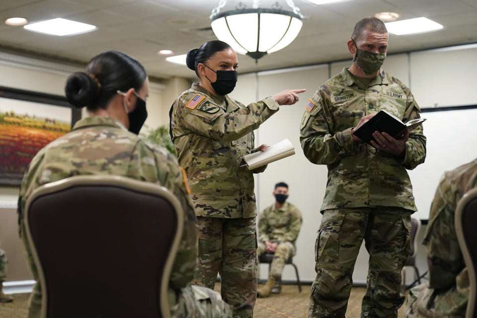 Soldiers give feedback to and Sgt. Maj. Julie Guerra, People First Task Force, center, and Segreant Major of the Army Michael Grinston, right, about their concerns at Fort Hood, Texas, Thursday, Jan. 7, 2021. Following more than two dozen soldier deaths in 2020, including multiple homicides, the U.S. Army Base is facing an issue of distrust among soldiers. (AP Photo/Eric Gay)