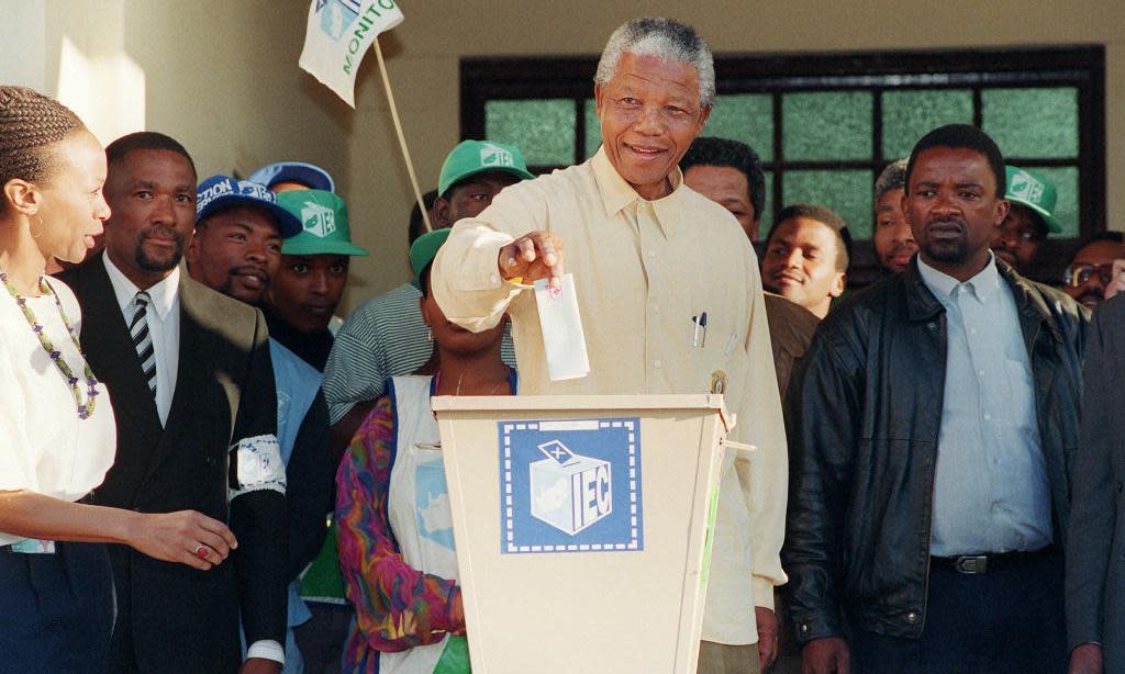 <span>Nelson Mandela casts his vote in South Africa’s first all-race election, Oshlange, black township near Durban, 27 April 1994.</span><span>Photograph: Walter Dhladhla/AFP/Getty</span>