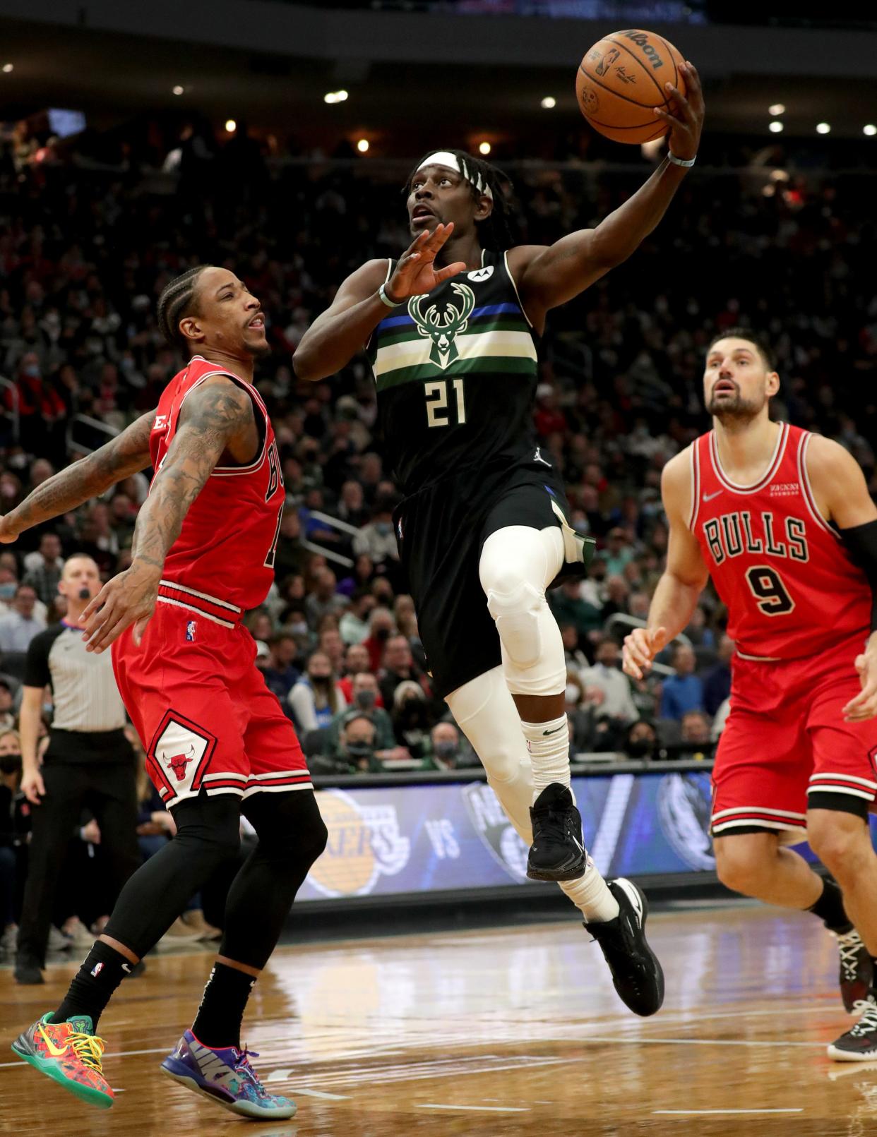 Jrue Holiday and the Bucks begin their NBA title defense Sunday.