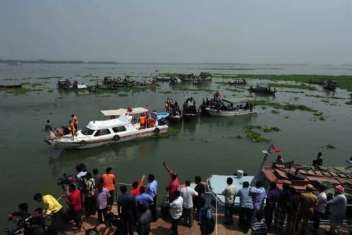 Rescuers recover the bodies of passengers after a ferry sank in Munshiganj, southeast of the Bangladeshi capital Dhaka. Rescue workers and divers in Bangladesh on Wednesday pulled scores of bodies from the wreckage of a ferry that sank after being hit by an oil barge, as the death toll rose to 112