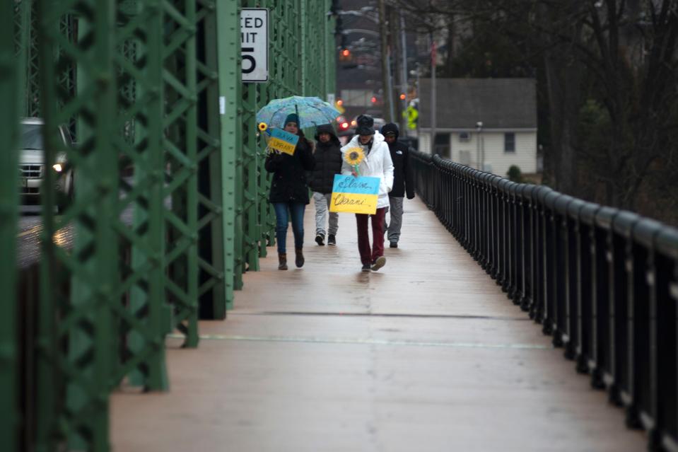 Protesters walk back from the rally in support of Ukraine on New Hope-Lambertville bridge on Wednesday, March 9, 2022. Several New Hope and Lambertville organizations came together to stand in solidarity with Ukrainian people.