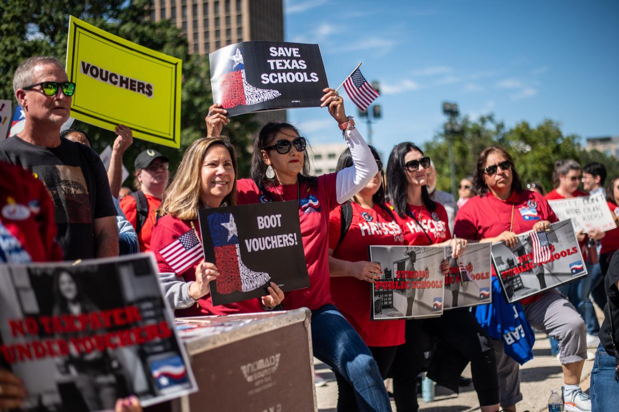 Parents and teachers rally Oct. 7 outside the Capitol against using public money for vouchers to attend private schools, saying that such school choice proposals will hurt public schools in Texas.