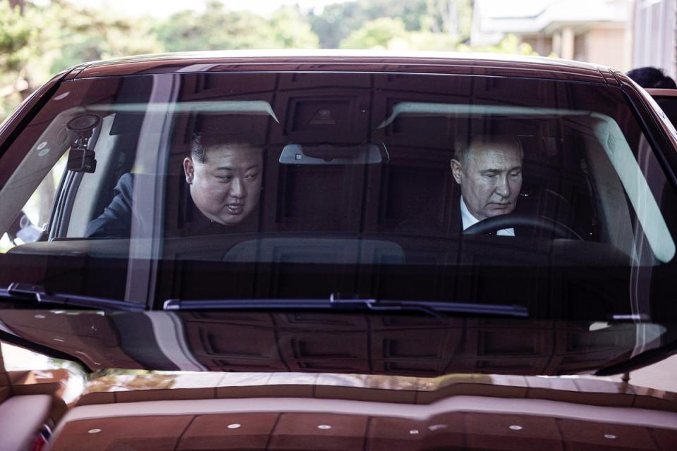 The two leaders ride in an Aurus car, a gift from Putin to his host (EPA)