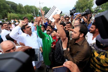 Opponents of Pakistan's Prime Minister Nawaz Sharif shout slogans after the Supreme Court's decision to disqualify Sharif, in Islamabad, Pakistan July 28, 2017. REUTERS/Faisal Mahmood