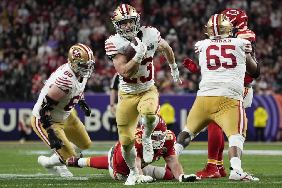 San Francisco 49ers running back Christian McCaffrey (23) runs into the end zone for a topuchdown against the Kansas City Chiefs during the first half of the NFL Super Bowl 58 football game Sunday, Feb. 11, 2024, in Las Vegas. (AP Photo/George Walker IV)