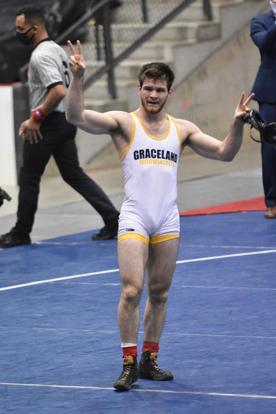 Graceland University junior Brennan Swafford, a Mediapolis High School graduate, celebrates after winning the 174-pound national championship Saturday at the NAIA Championships at Hartman Arena in Park City, Kansas.