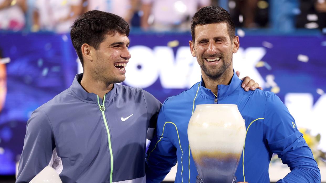  Carlos Alcaraz of Spain and Novak Djokovic of Serbia pose with their trophies after the final of the Western & Southern Open at Lindner Family Tennis Center on August 20, 2023 in Mason, Ohio.  