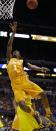 Tennessee's Josh Richardson (1) shoots over Michigan's Jordan Morgan during the first half of an NCAA Midwest Regional semifinal college basketball tournament game Friday, March 28, 2014, in Indianapolis. (AP Photo/Michael Conroy)