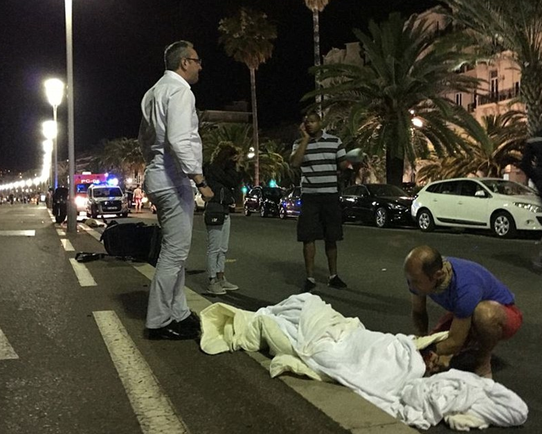 A victim appears to be wrapped in a white blanket following a deadly attack in Nice. Photo: Getty