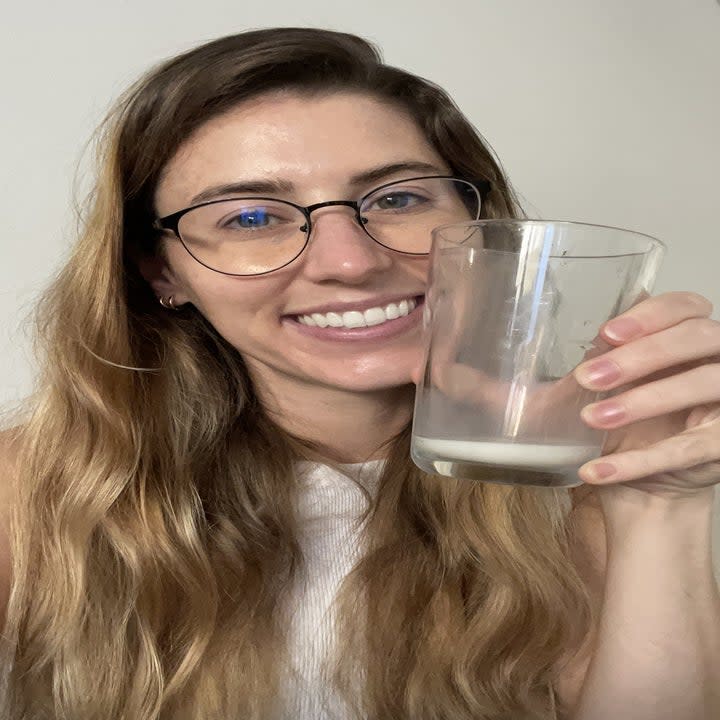 farrah with small glass of oatmilk