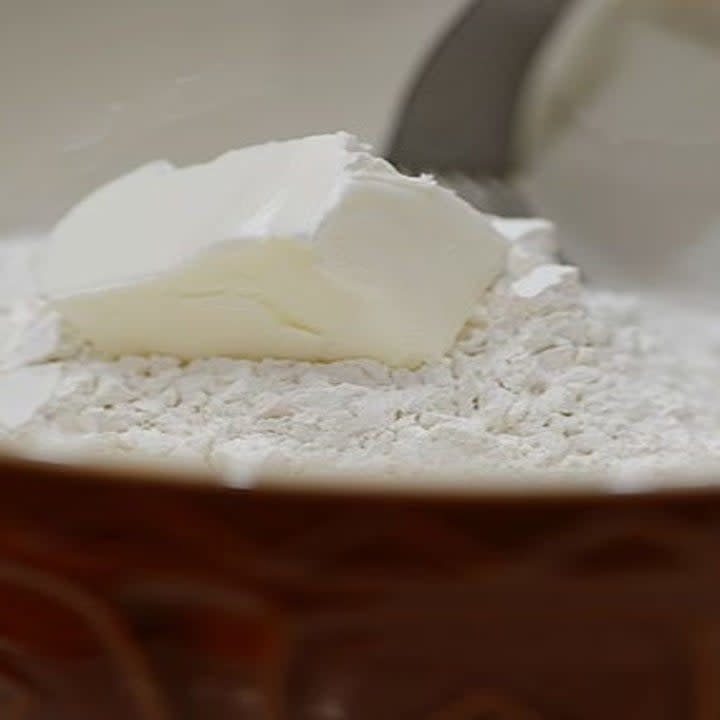 Shortening and flour in a mixing bowl