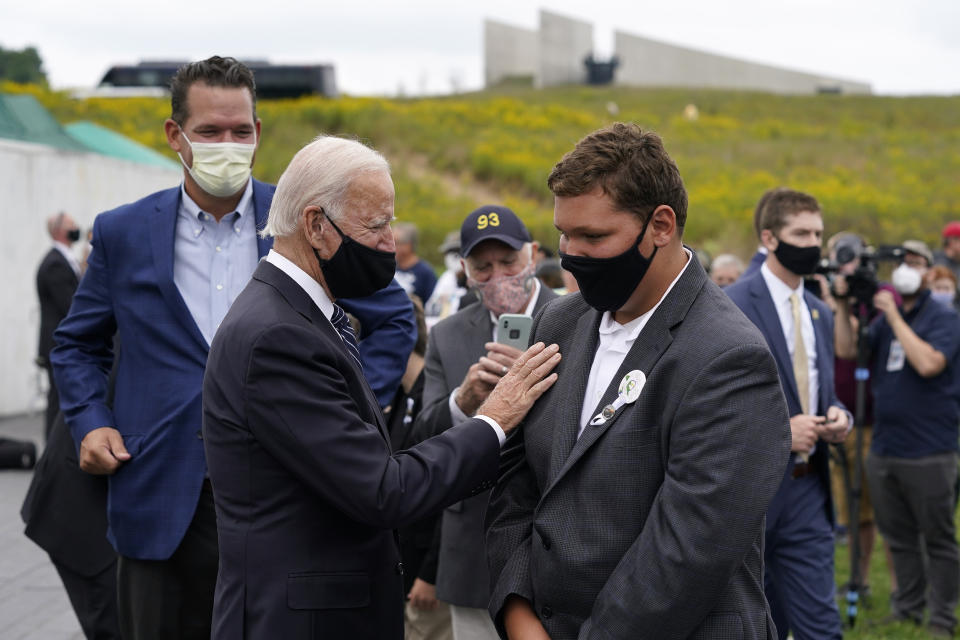 Democratic presidential candidate and former Vice President Joe Biden speaks with family members of victims of Flight 93 during a visit to the Flight 93 National Memorial in Shanksville, Pa., Friday, Sept. 11, 2020, to commemorate the 19th anniversary of the Sept. 11 terrorist attacks. (AP Photo/Patrick Semansky)