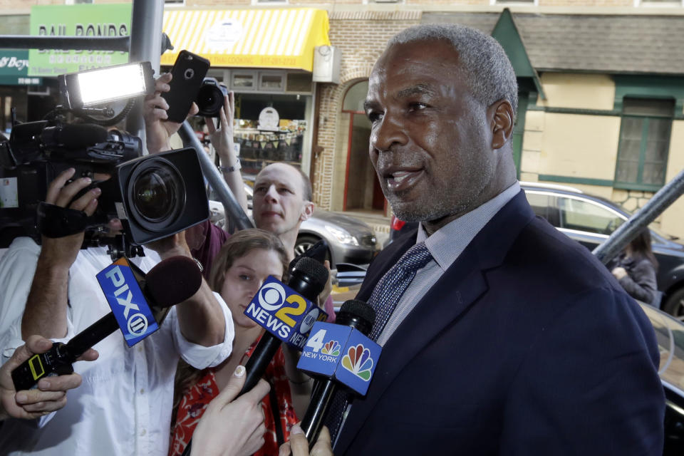 Charles Oakley talks to reporters after filing a lawsuit against Knicks owner James Dolan this past April. (AP)