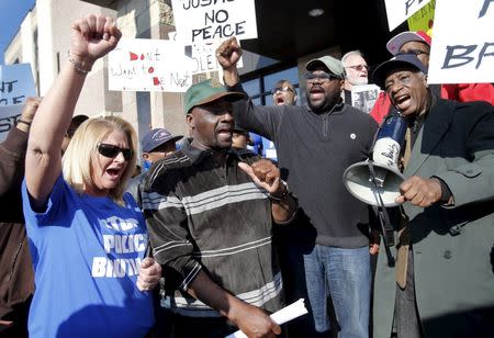 Floyd Dent (2nd L) takes part in a protest against police brutality outside the Inkster Police Department in Inkster, Michigan April 1, 2015. REUTERS/ Rebecca Cook