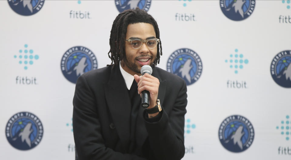 New Minnesota Timberwolves NBA basketball player D'Angelo Russell addresses the media after he was introduced, Friday, Feb. 7, 2020, in Minneapolis, following a trade that sent Timberwolves' Andrew Wiggins to the Golden State Warriors. (AP Photo/Jim Mone)